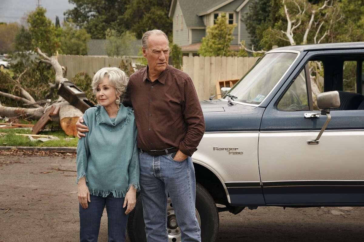 MeeMaw and Dale Ballard stand together after the tornado in an episode of