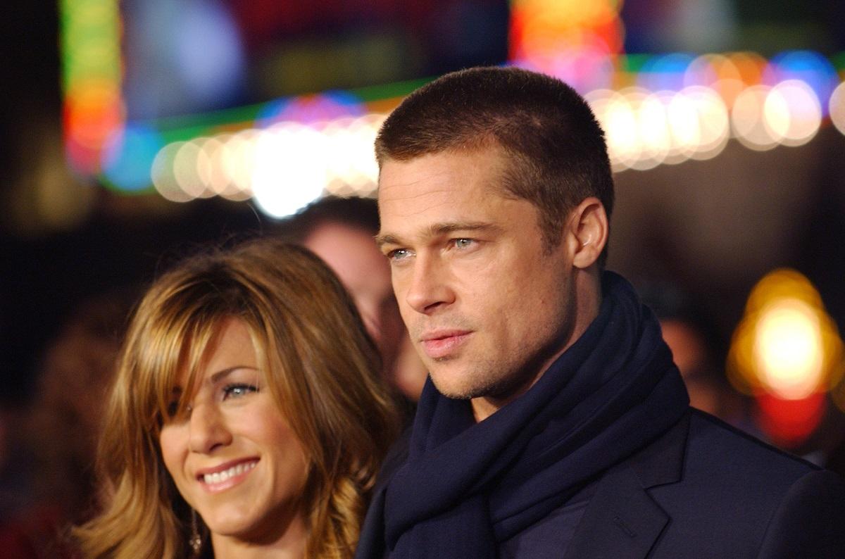 Brad Pitt and Jennifer Aniston smiling at a movie premiere.