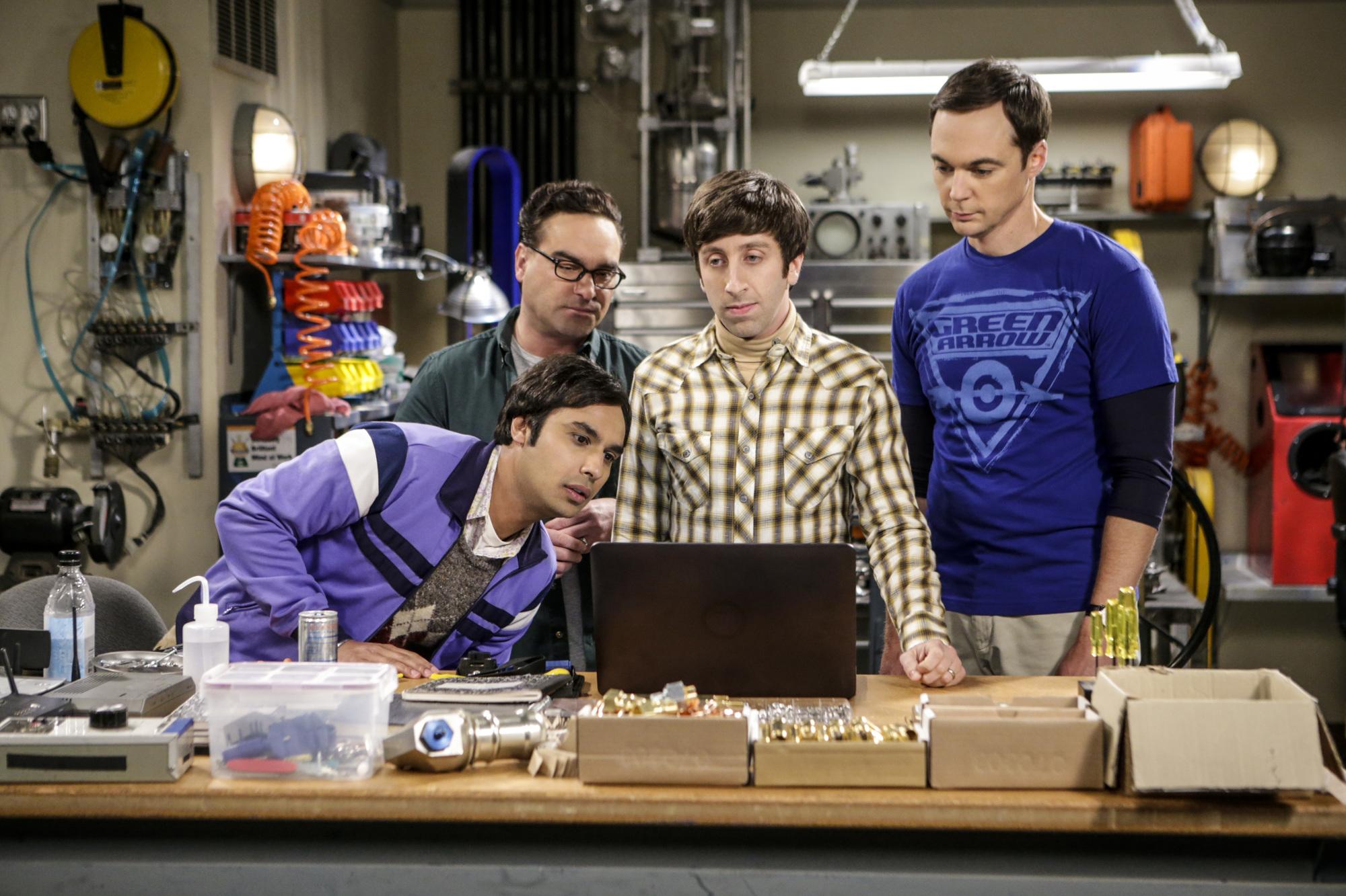 Raj, Leonard, Howard and Sheldon stand around Howard